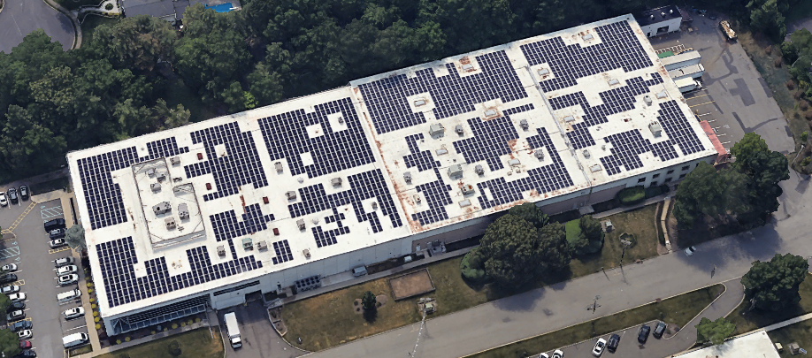 commercial solar case studies – Solar Cents customer success. Close-up of commercial solar electrical wiring and conduit installation on a New Jersey rooftop system.